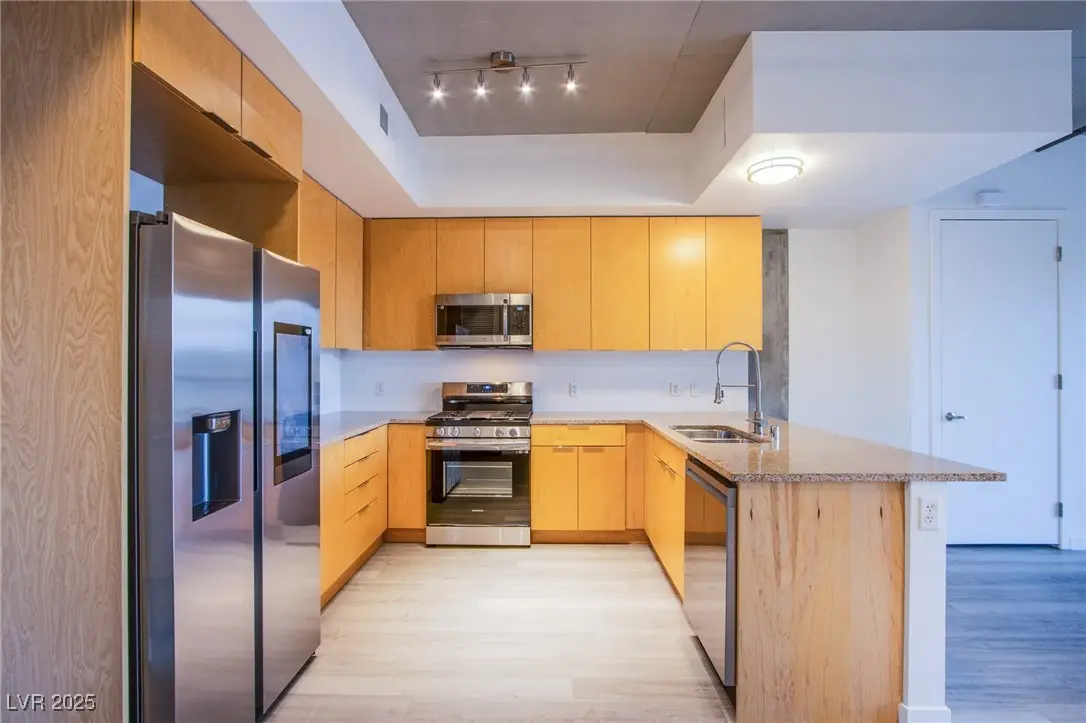 Modern JUHL condo interior with contemporary kitchen